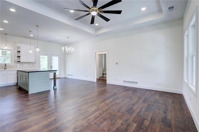 220 Rock Bridge Pkwy, Excelsior Springs, MO 64024 - kitchen featuring a tray ceiling, open shelves, french doors, dark wood finished floors, and white cabinets