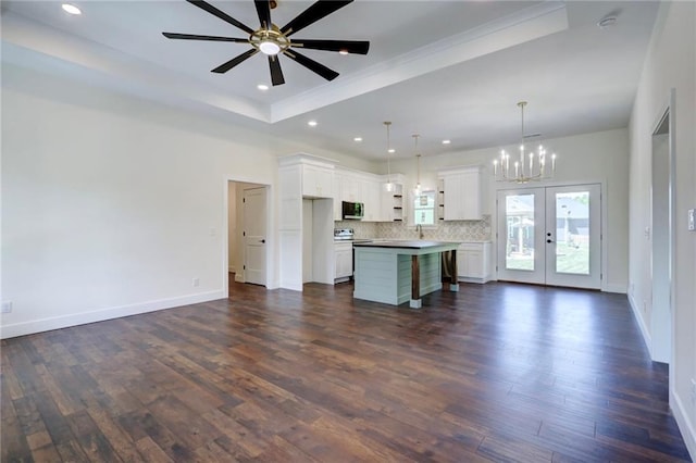 220 Rock Bridge Pkwy, Excelsior Springs, MO 64024 - unfurnished living room featuring a chandelier, dark wood finished floors, baseboards, recessed lighting, and a ceiling fan