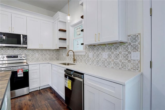 220 Rock Bridge Pkwy, Excelsior Springs, MO 64024 - kitchen with stainless steel appliances, a sink, open shelves, and light countertops