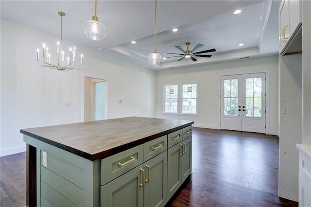 220 Rock Bridge Pkwy, Excelsior Springs, MO 64024 - kitchen featuring butcher block counters, a tray ceiling, dark wood-style floors, baseboards, and recessed lighting