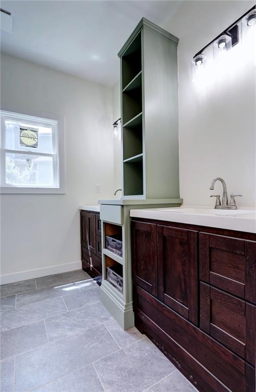 220 Rock Bridge Pkwy, Excelsior Springs, MO 64024 - bathroom featuring vanity and baseboards