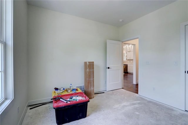 220 Rock Bridge Pkwy, Excelsior Springs, MO 64024 - bedroom with unfinished concrete floors and baseboards