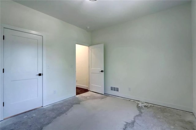 220 Rock Bridge Pkwy, Excelsior Springs, MO 64024 - unfurnished bedroom with unfinished concrete floors and baseboards