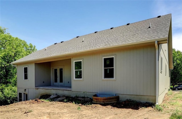 220 Rock Bridge Pkwy, Excelsior Springs, MO 64024 - rear view of property with french doors and roof with shingles