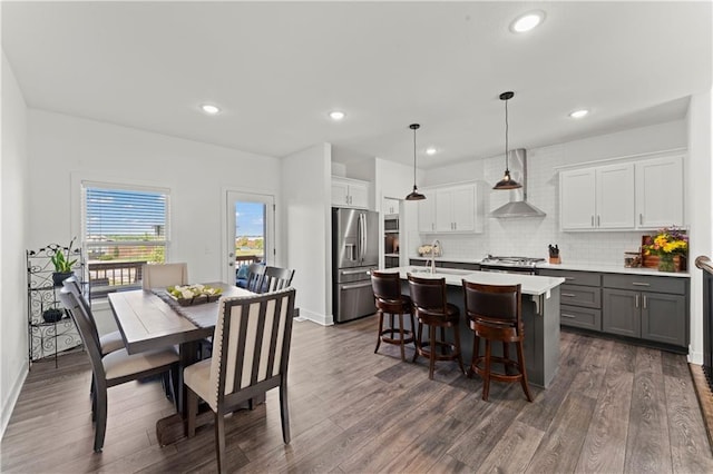 29702 W 195th St, Gardner, KS 66030 - dining space featuring dark wood-style flooring, recessed lighting, and baseboards