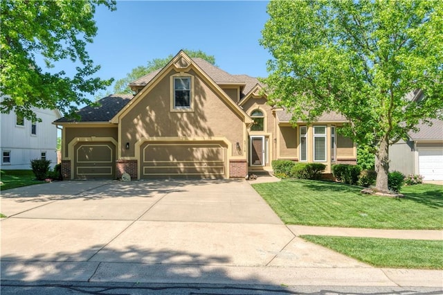 5714 Alden Ct, Shawnee, KS 66216 - traditional-style house featuring driveway, a front yard, brick siding, stucco siding, and a garage