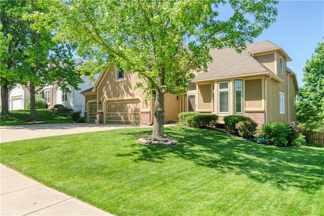 5714 Alden Ct, Shawnee, KS 66216 - view of front of house featuring concrete driveway, brick siding, stucco siding, roof with shingles, and an attached garage