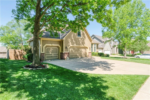 5714 Alden Ct, Shawnee, KS 66216 - view of front facade featuring brick siding, driveway, stucco siding, a front lawn, and a garage