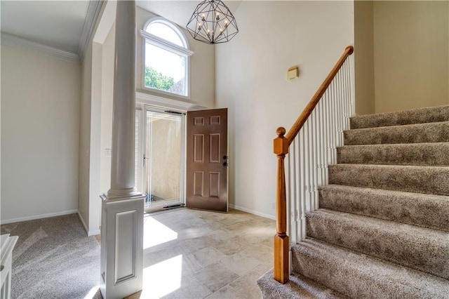 5714 Alden Ct, Shawnee, KS 66216 - foyer with stairway, a chandelier, crown molding, baseboards, and a towering ceiling