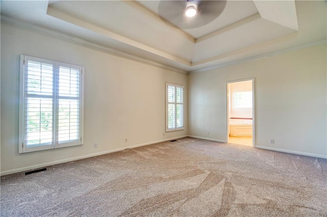 5714 Alden Ct, Shawnee, KS 66216 - carpeted empty room featuring a raised ceiling, ceiling fan, crown molding, and baseboards