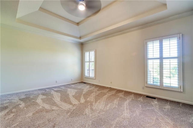 5714 Alden Ct, Shawnee, KS 66216 - unfurnished room with a tray ceiling, crown molding, ceiling fan, carpet, and baseboards