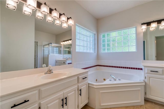 5714 Alden Ct, Shawnee, KS 66216 - bathroom with two vanities, a shower stall, a whirlpool tub, and tile patterned flooring