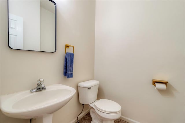 5714 Alden Ct, Shawnee, KS 66216 - half bath featuring baseboards, toilet, and a sink