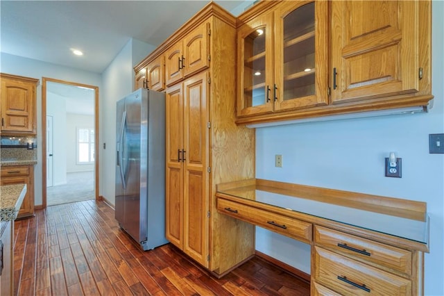5714 Alden Ct, Shawnee, KS 66216 - kitchen with stainless steel refrigerator with ice dispenser, dark wood-style flooring, glass insert cabinets, baseboards, and brown cabinets