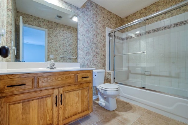 5714 Alden Ct, Shawnee, KS 66216 - bathroom featuring vanity, toilet, wallpapered walls, and combined bath / shower with glass door
