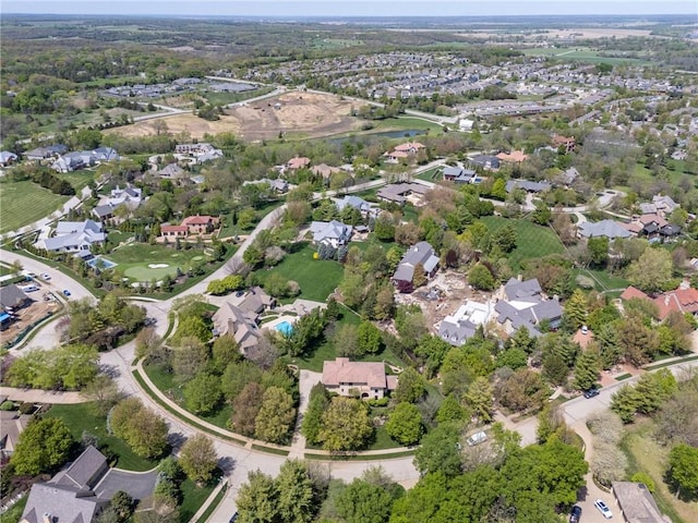 aerial view of property's location featuring nearby suburban area
