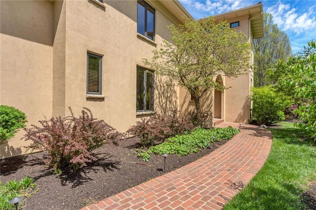 property entrance featuring stucco siding