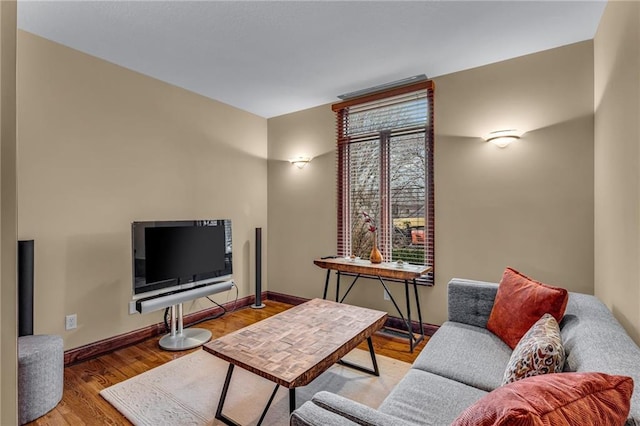 living room with wood finished floors and baseboards