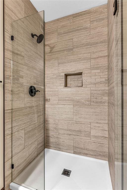 full bathroom featuring a stall shower