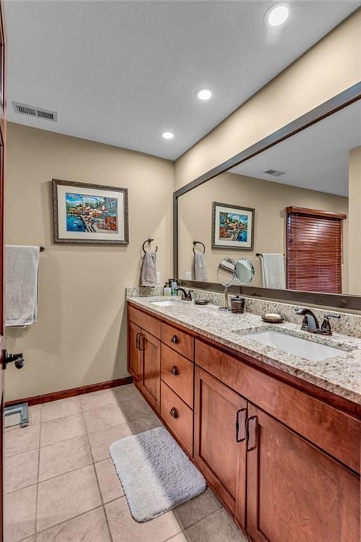 full bathroom with double vanity, baseboards, tile patterned floors, and recessed lighting