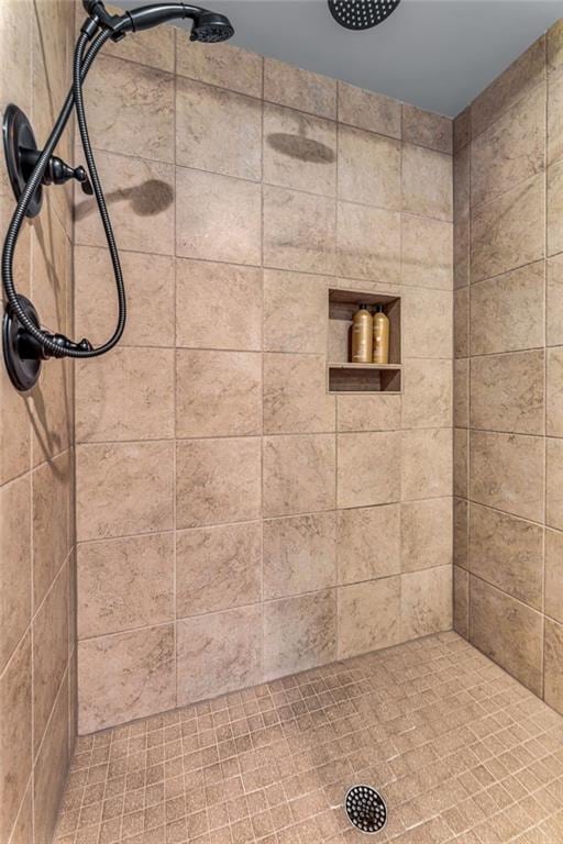 bathroom with tiled shower
