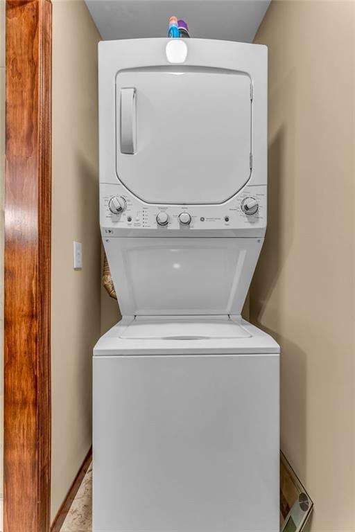 washroom with stacked washer / dryer