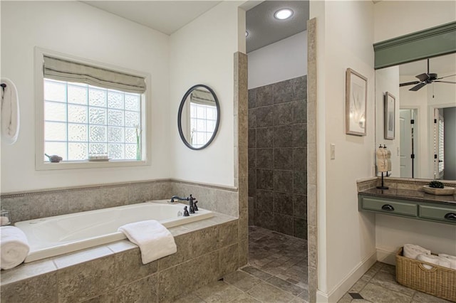 full bath featuring plenty of natural light, a garden tub, a walk in shower, and ceiling fan