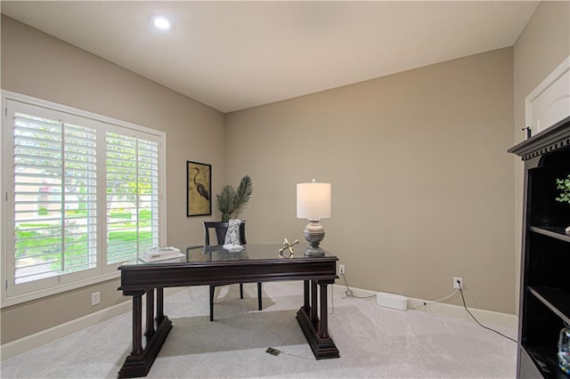 office featuring carpet, baseboards, and plenty of natural light