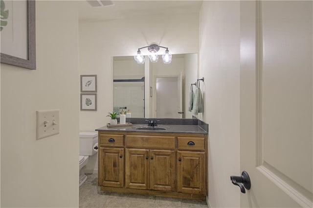 bathroom with toilet and vanity