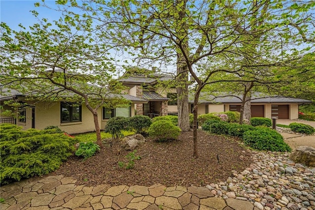 8700 Lee Blvd, Leawood, KS 66206 - view of front of property with concrete driveway and a garage