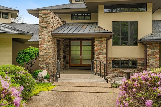 8700 Lee Blvd, Leawood, KS 66206 - entrance to property with french doors, stone siding, stucco siding, and a standing seam roof