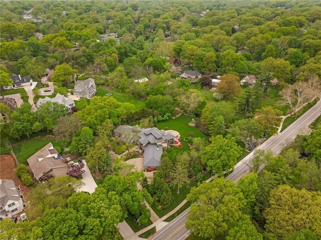 8700 Lee Blvd, Leawood, KS 66206 - aerial view of property and surrounding area featuring nearby suburban area and a forest