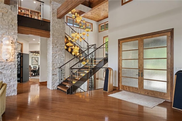 8700 Lee Blvd, Leawood, KS 66206 - foyer entrance with a high ceiling, stairs, wood finished floors, french doors, and a chandelier