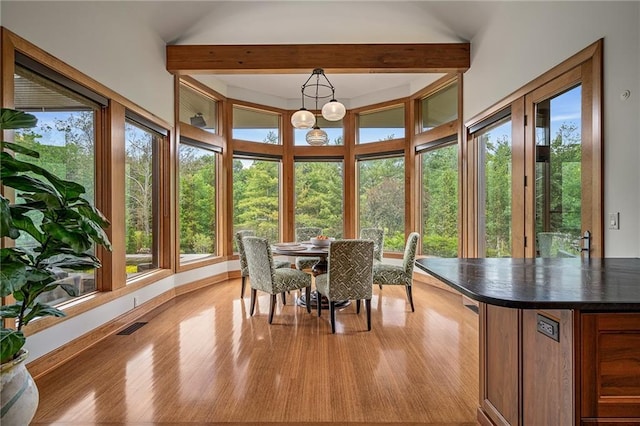 8700 Lee Blvd, Leawood, KS 66206 - sunroom / solarium with healthy amount of natural light, wood finished floors, baseboards, and a chandelier