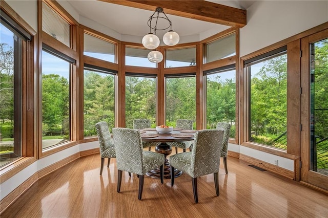 8700 Lee Blvd, Leawood, KS 66206 - sunroom featuring baseboards, wood finished floors, and plenty of natural light