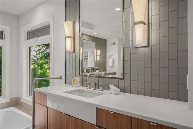 8700 Lee Blvd, Leawood, KS 66206 - bathroom featuring vanity, recessed lighting, and a bath