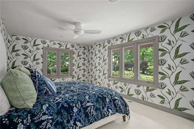 8700 Lee Blvd, Leawood, KS 66206 - bedroom featuring wallpapered walls, a ceiling fan, multiple windows, and baseboards
