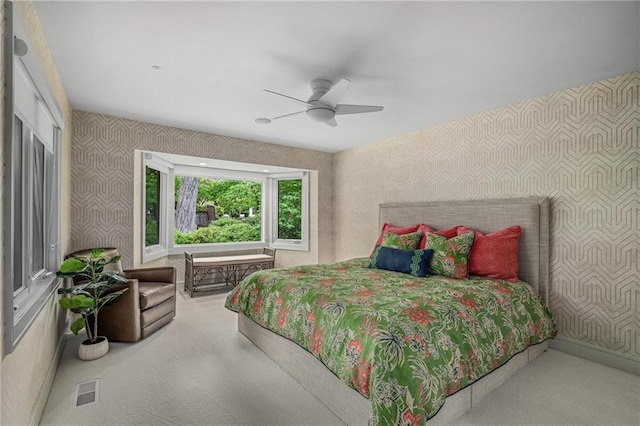 8700 Lee Blvd, Leawood, KS 66206 - carpeted bedroom with wallpapered walls and ceiling fan