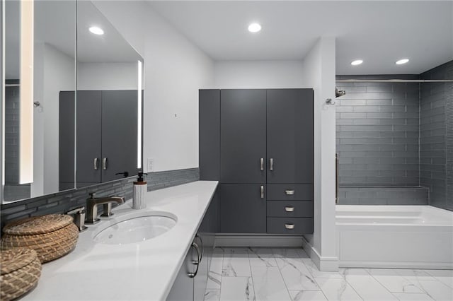 8700 Lee Blvd, Leawood, KS 66206 - bathroom featuring marble look tiles, vanity, recessed lighting, and shower / washtub combination