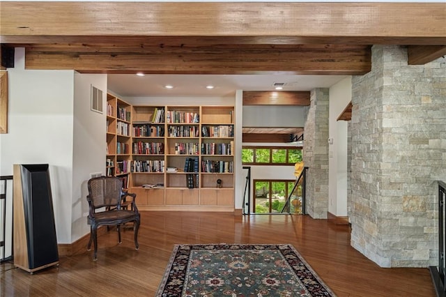 8700 Lee Blvd, Leawood, KS 66206 - sitting room with wood finished floors, a fireplace, beamed ceiling, and baseboards