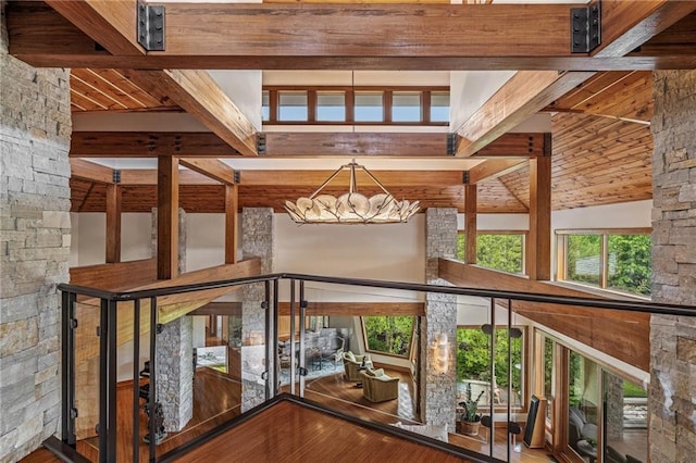 8700 Lee Blvd, Leawood, KS 66206 - staircase with beam ceiling, a chandelier, and wood finished floors