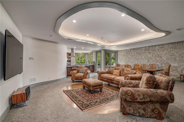 8700 Lee Blvd, Leawood, KS 66206 - living area with a tray ceiling, baseboards, recessed lighting, and speckle patterned floor