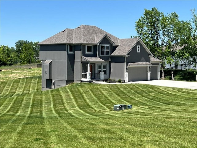 7812 N Spruce Ave, Kansas City, MO 64119 - view of front facade with a front yard, a garage, concrete driveway, and roof with shingles