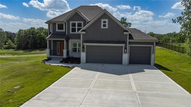 7812 N Spruce Ave, Kansas City, MO 64119 - craftsman-style home with concrete driveway and a garage