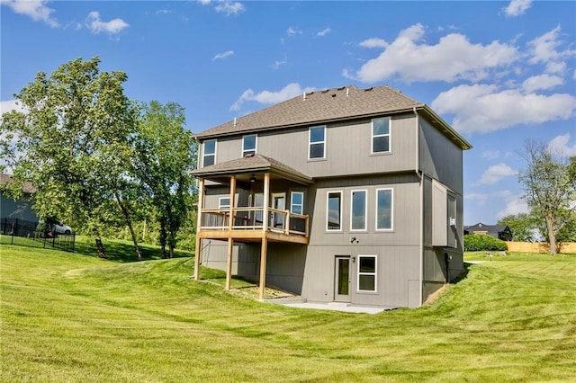 7812 N Spruce Ave, Kansas City, MO 64119 - back of house with a lawn and a patio