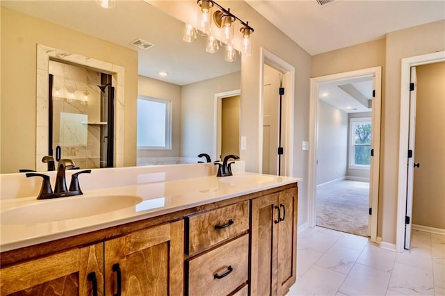 7812 N Spruce Ave, Kansas City, MO 64119 - full bath with a stall shower, baseboards, marble finish floors, and double vanity