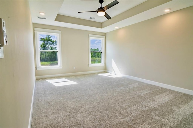 7812 N Spruce Ave, Kansas City, MO 64119 - empty room with plenty of natural light, baseboards, carpet floors, and a ceiling fan