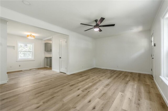 3113 55th St, Kansas City, MO 64119 - unfurnished room with ceiling fan, light wood-type flooring, and baseboards