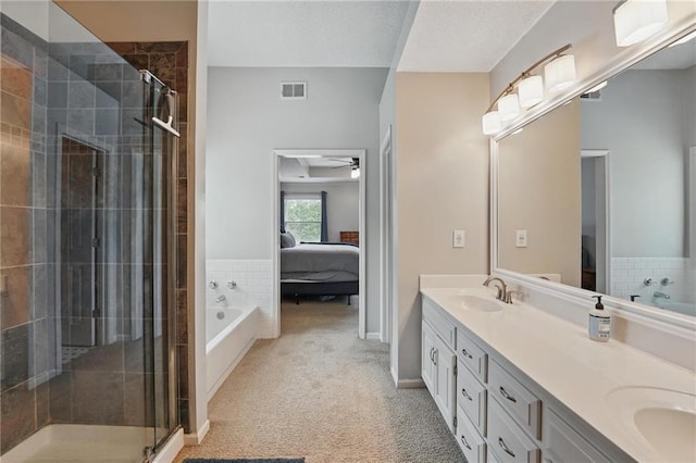 12287 S Mullen Rd, Olathe, KS 66062 - ensuite bathroom with double vanity, a stall shower, a garden tub, and a ceiling fan