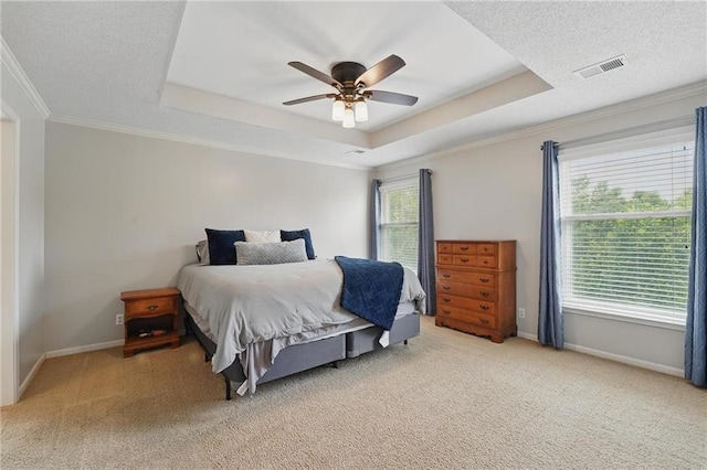 12287 S Mullen Rd, Olathe, KS 66062 - bedroom with a tray ceiling, light colored carpet, baseboards, crown molding, and ceiling fan